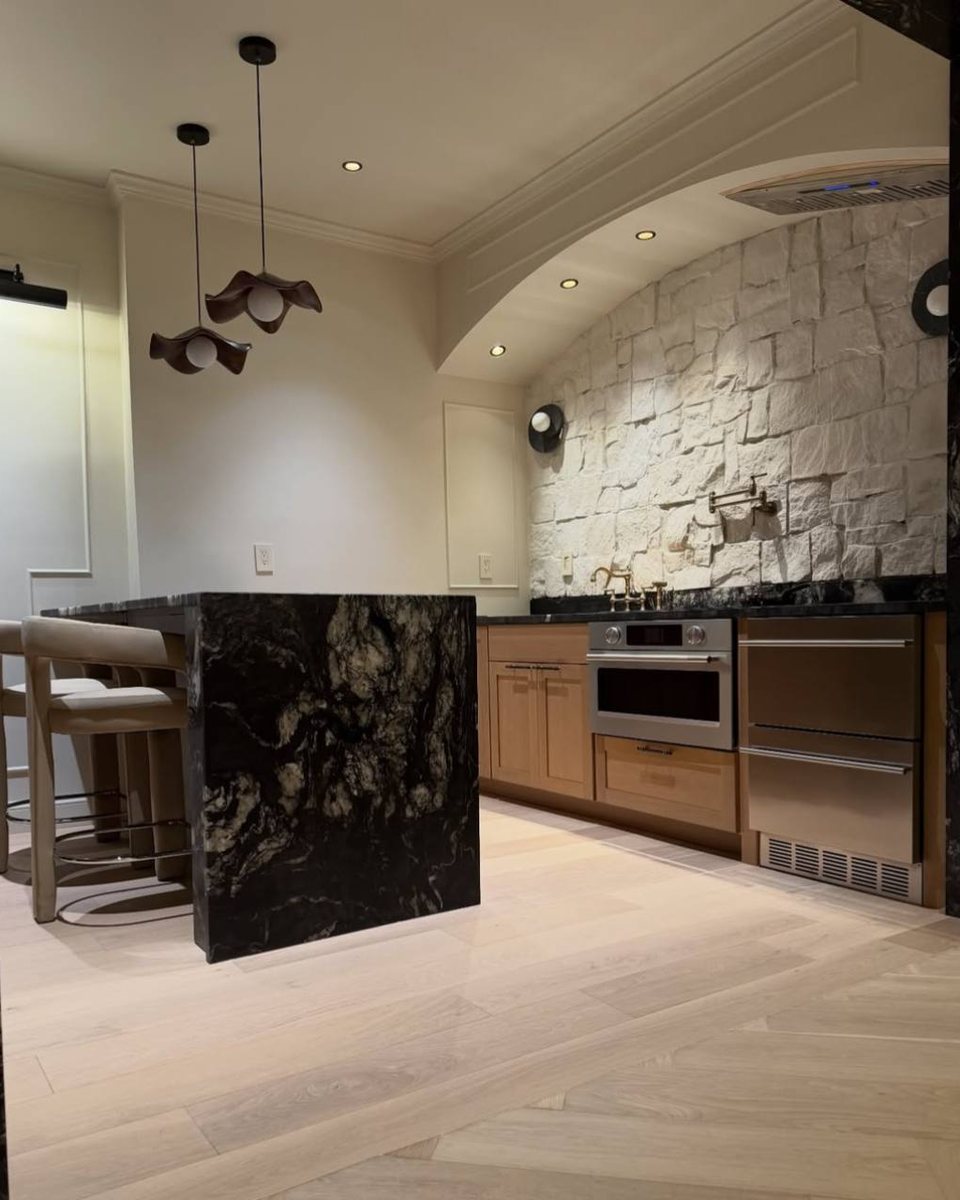 Finished Revamp project photo showing a clean kitchen buildout with stone surfaces